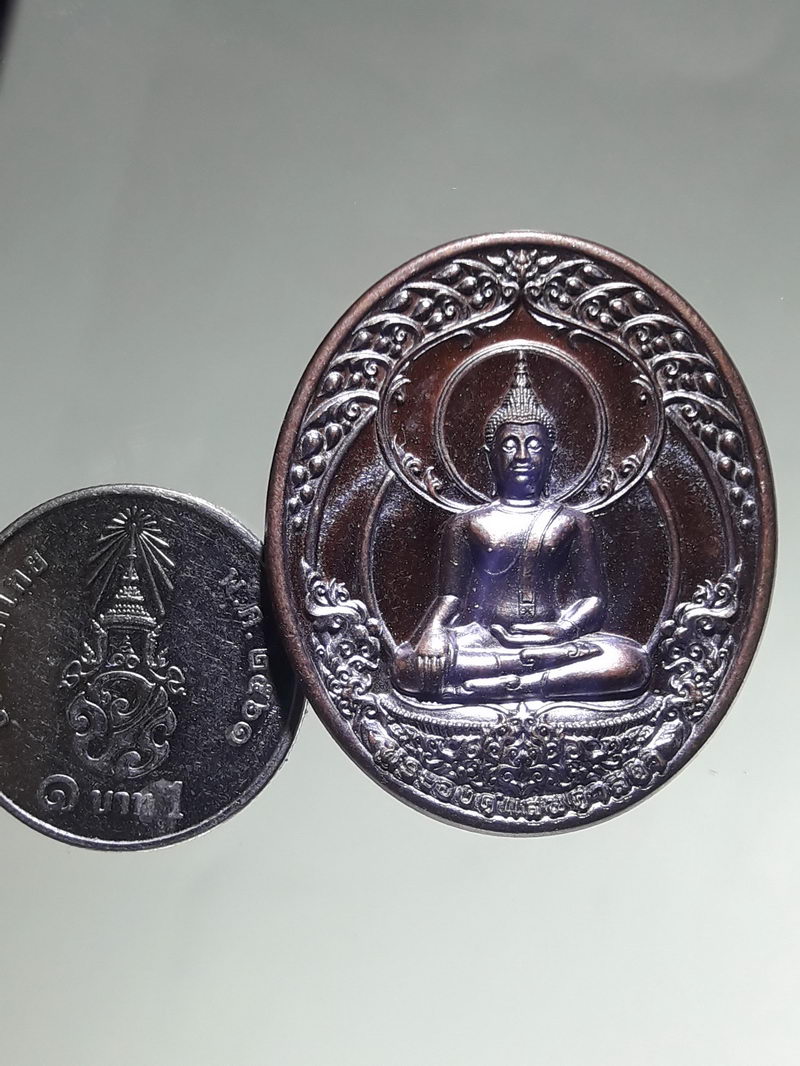 รหัสสินค้า เหรียญพระพุทธ 4339 เหรียญพระองค์แสนศาสดา ที่ระลึกหุ้มทองยอดพระธาตุ จัดสร้างปี 2563 โค้ชเลเซอร์ ด้านหลัง หมายเลข 373