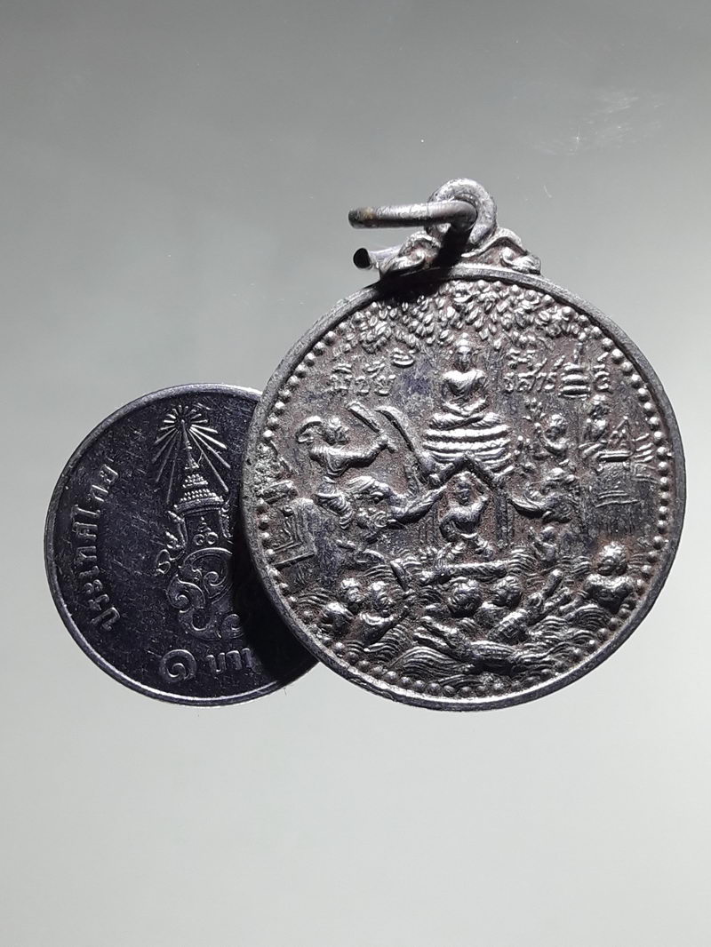 รหัสสินค้า เหรียญพระพุทธ 4323 เหรียญกลมกะไหล่นิกเกิล พระพุทธเจ้าผจญพญามาร ที่ระลึกในการสร้างพระอุโบสถ วัดศรีโสภณ อำเภอวังทอง จังหวัดพิษณุโลก สร้างปี 2523 หลังสมเด็จพระนเรศวรประกาศอิสรภาพ