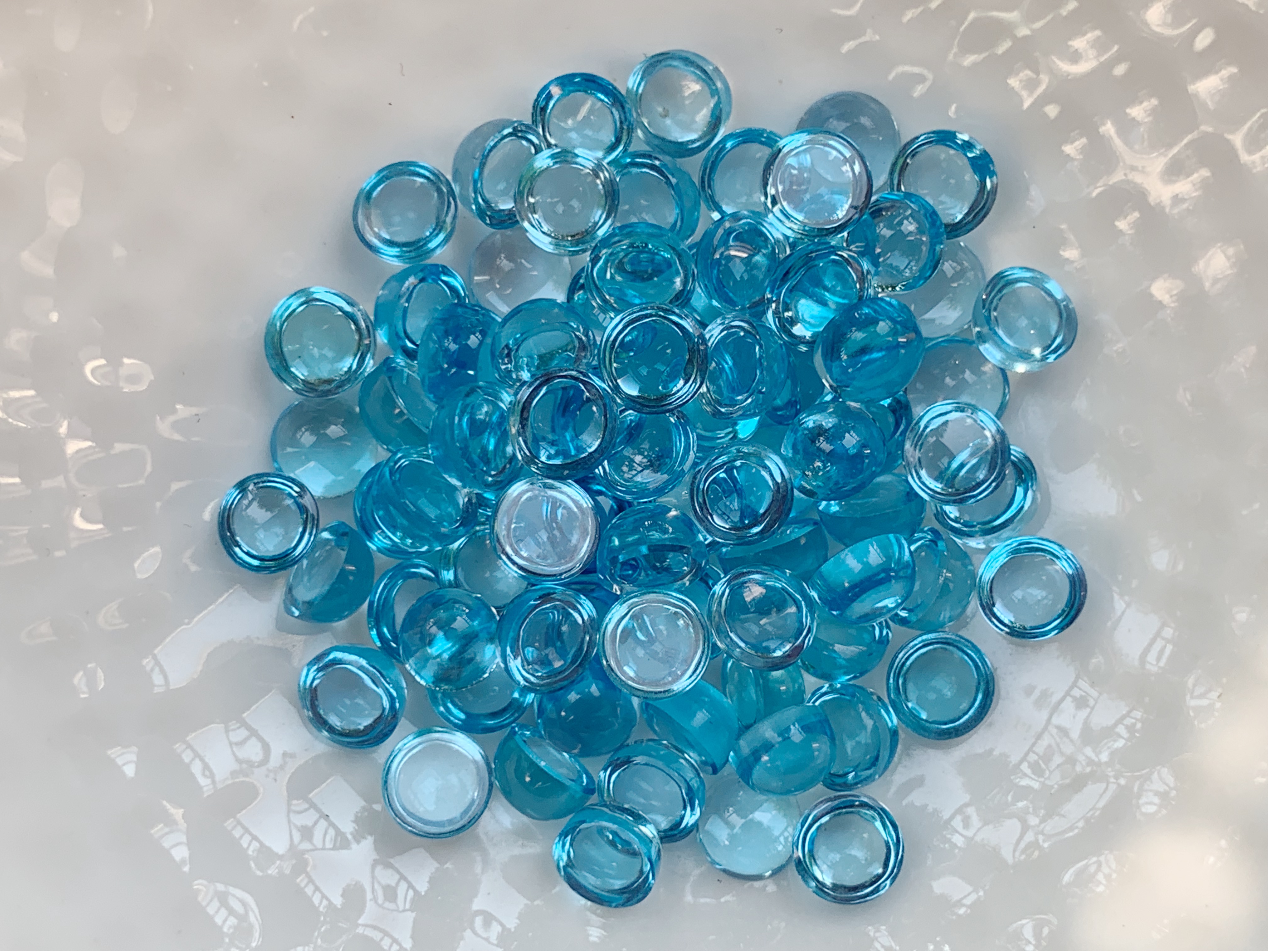 บลูโทปาสกลมหลังเบี้ย 5.0 มม. 5 กะรัต