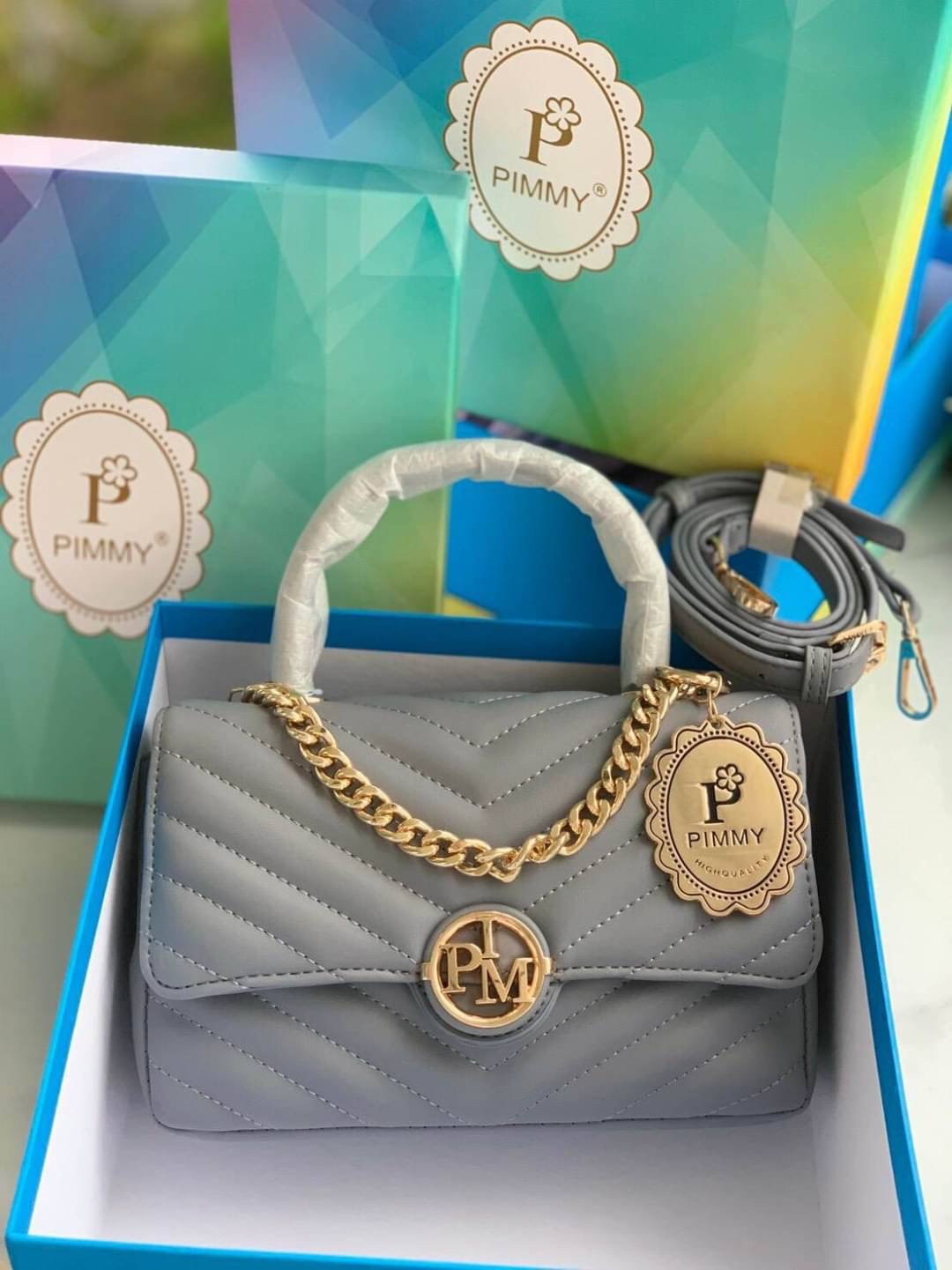 กระเป๋าpimmy แต่งโลโก้กลม ตรงกลาง สวยน่าใช้