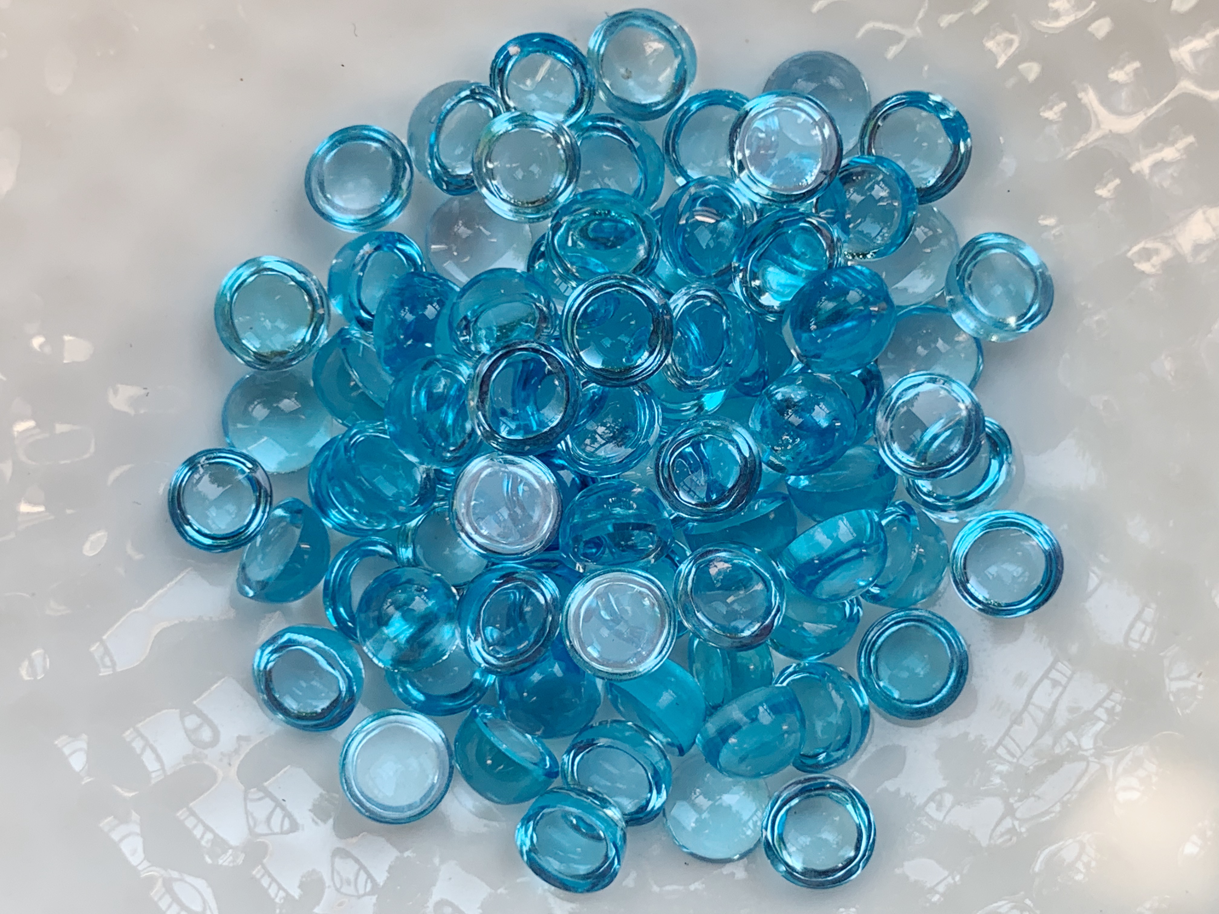 บลูโทปาสกลมหลังเบี้ย 5.0 มม. 5 กะรัต