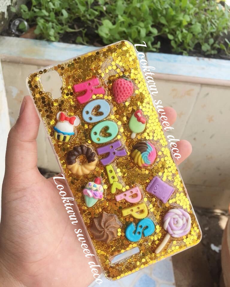 เคสกากเพชรสีทองวิ้ง อักษรฟ้อนท์กระดุม