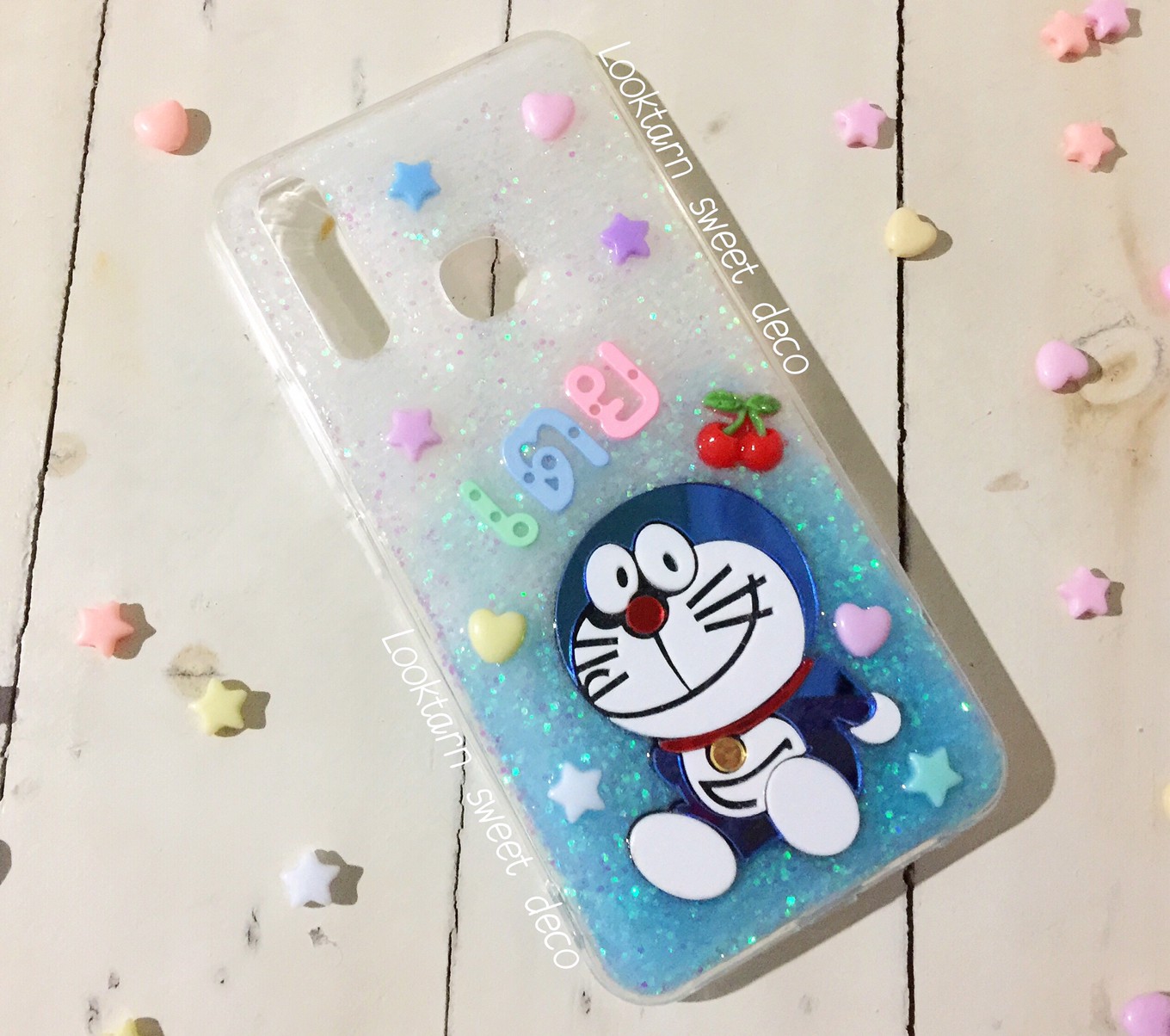 เคสกากเพชรสีขาว ฟ้า อะคริลิคโดเรม่อน อักษรคละสี