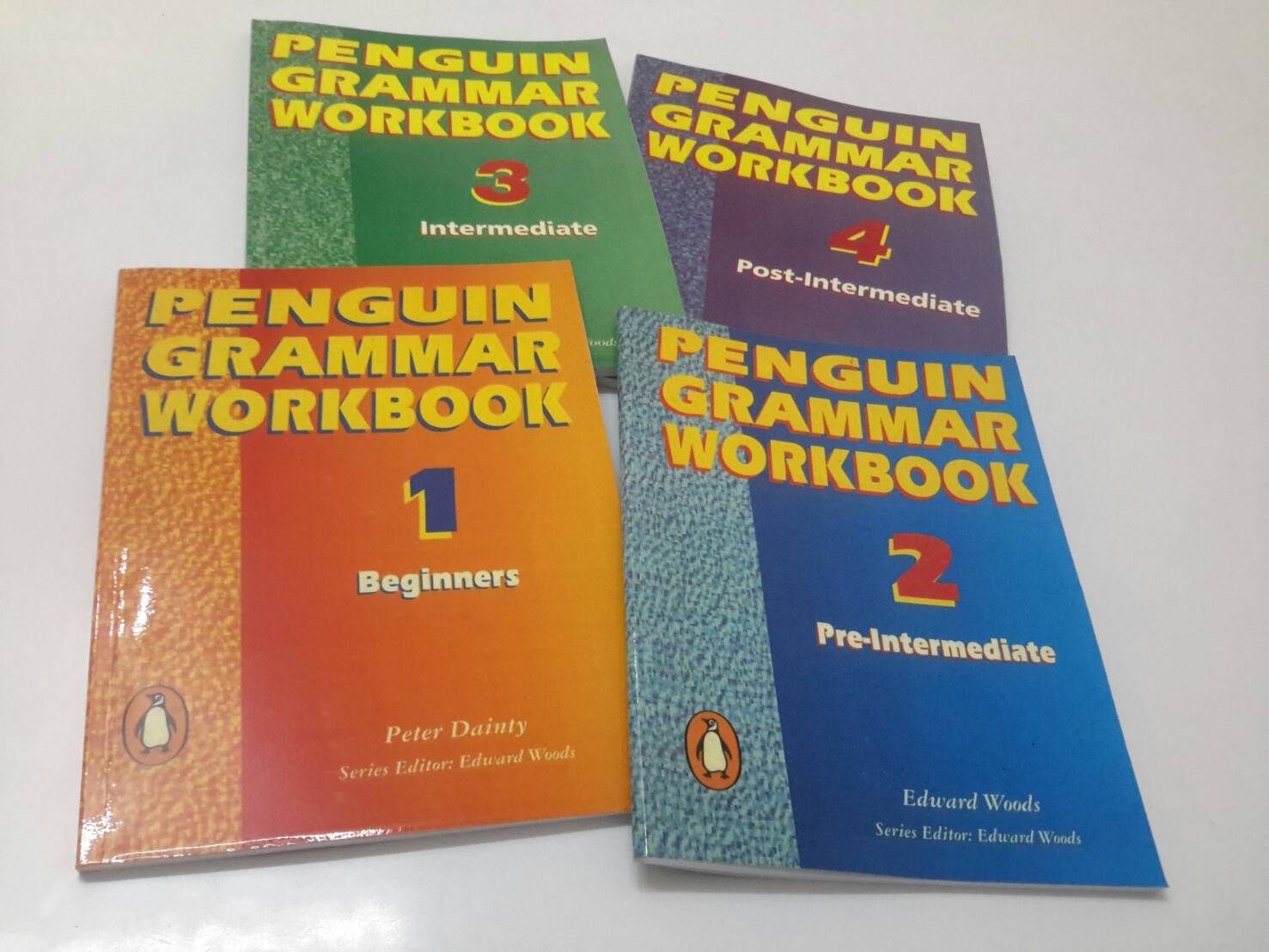 PENGUIN GRAMMAR WORKBOOK 1, 2, 3, 4 รวม 4 เล่ม ตั้งแต่ Beginner , Pre-Intermediate, Intermediate และ Post-Intermediate โดย Peter Dainty, Edward Woods, Tim Kelly and Neil McBurney (มีเฉลยในเล่ม)